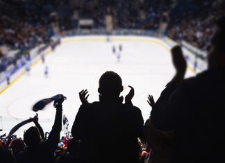 NHL Player Taken Off-Ice On Stretcher After Terrifying Collision